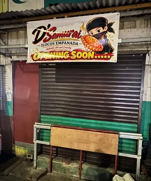 The Addition Hills stall shutter with its D'Samurai opening banner