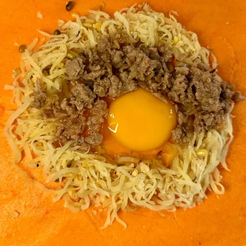 Special empanada before folding: papaya, Ilocos longganisa and a raw egg